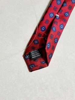 CRAVATTA MOTIVO FIORELLINO ROMBO ROSSO BLU